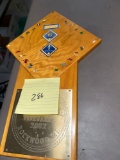 boy Scout plaque with pins and badges