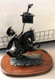 Signed metal figurine