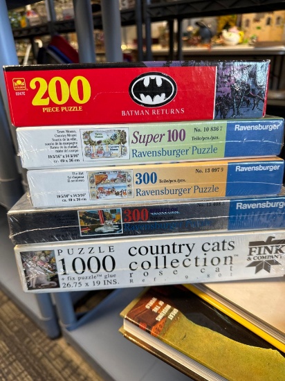 lot of five puzzles sealed