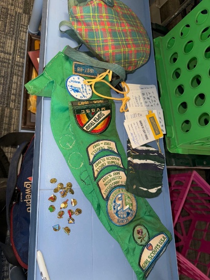 assortment of Girl Scout patches and Boy Scout pins
