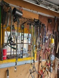 assorted tools and miscellaneous on wall