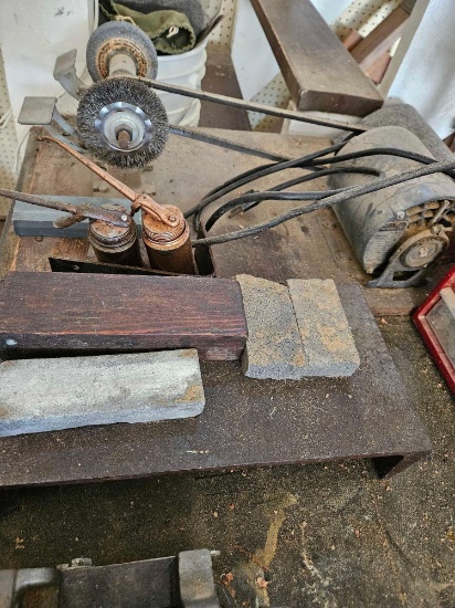 Grinding wheel, sharpening stones and steel shelf.