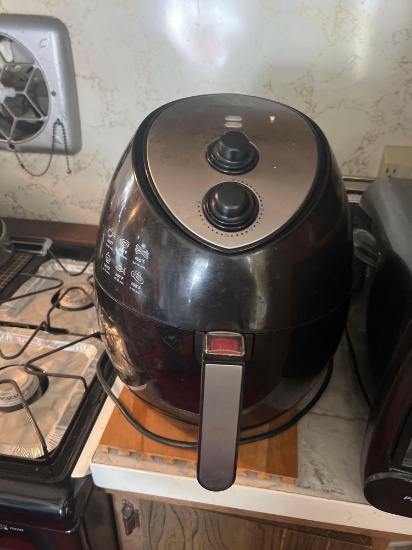Air fryer and waffle maker in kitchen