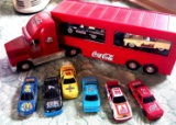 Coca Cola semi and 6 hot wheels in kitchen