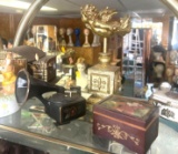 Shelf of music boxes and knickknacks