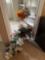 plant stand and artificial flower arrangements