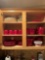 apartment kitchen cabinet red dishes and more