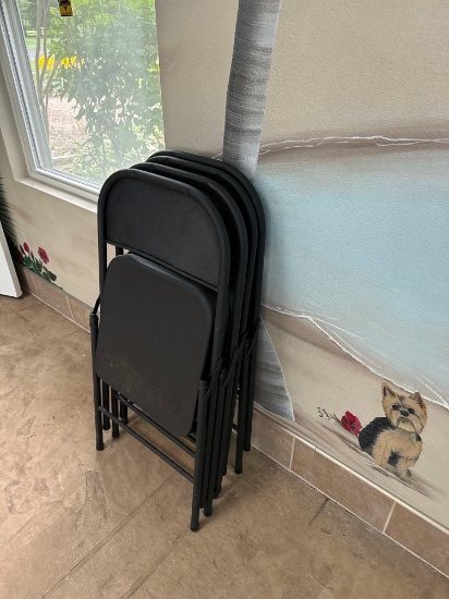 4 black folding chairs - pool room