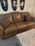Like New brown leather Ashley sofa -living room