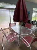 Patio table, 4 chairs, and umbrella. Like new condition - pool room