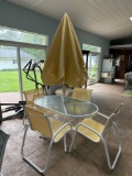 Patio table, 4 chairs, and umbrella. Like new condition - pool room