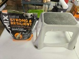 Step stool and partial bag of grass seed G1.