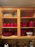 apartment kitchen cabinet red dishes and more