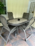patio table with four chairs outside