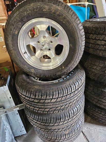 Set of dunlop P 235/60R15 tires on Aluminum wheels