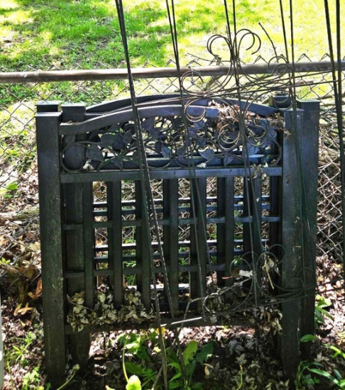 3 black fence panels and 2 trellis