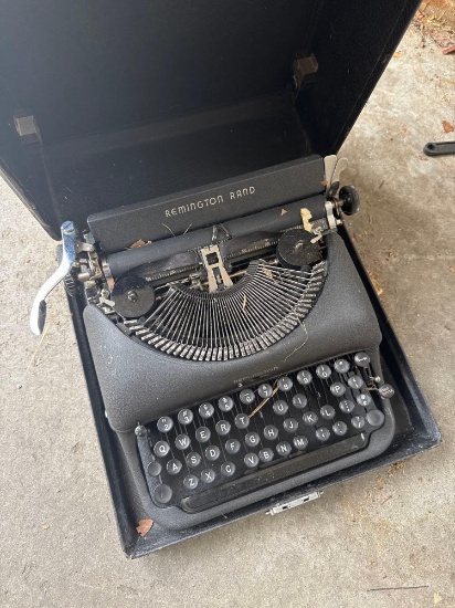 Vintage Remington Rand typewriter with case garage