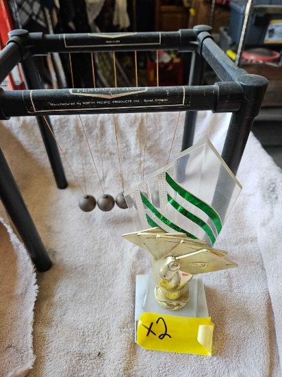 penduation and poker trophy