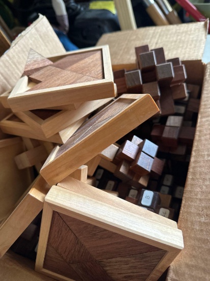 Box of wooden puzzles