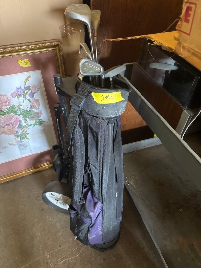 Golf Clubs and bag on wheels