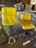 2- Yellow swivel adjustable height chairs