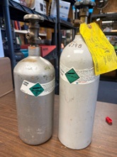 One empty, and one full non-flammable carbon dioxide tanks 17 inch tall