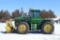 JD 8440 4WD Tractor and Degelman Dozer tied together