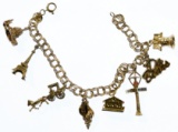 14k and 10k Gold Charms on a Gold Bracelet