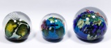 Josh Simpson (American, b.1949) 'Inhabited Planet' Art Glass Paperweight Collection