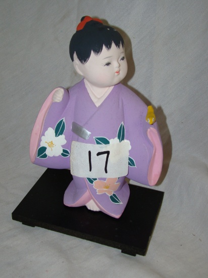 JAPAN GENUINE HAKATA DOLL, CHILD WITH BIRD WITH BASE. 8"