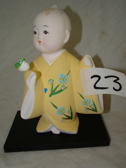 JAPAN HAKATA DOLL, BOY WITH BIRD WITH BASE. HAS PAINT MISSING FROM HEAD ARE