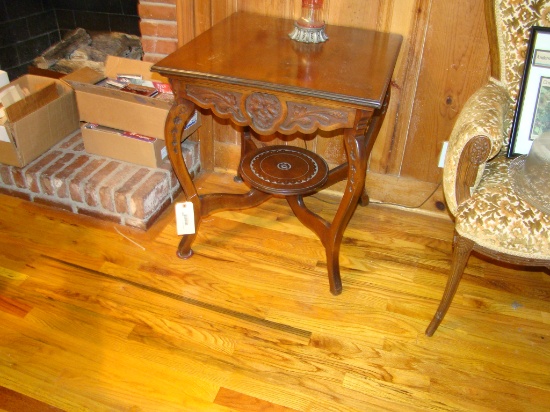 BEAUTIFUL CARVED LAMP TABLE WITH BASE ,FACES CARVED IN SKIRT OF TABLE