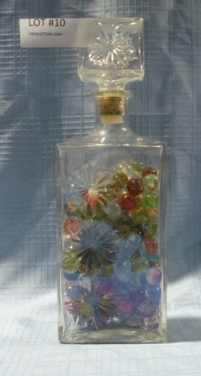 CLEAR GLASS DECANTER W/ASSORTED MARBLES