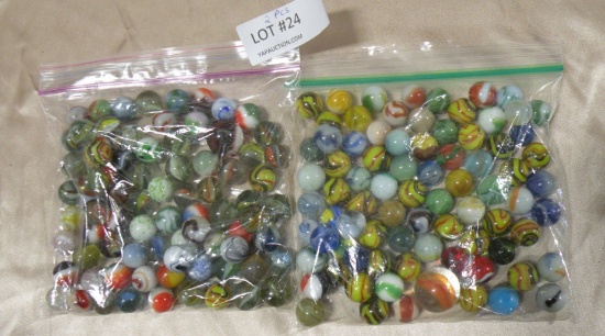 2 SANDWICH BAGS OF ASSORTED MARBLES