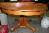 ANTIQUE OAK PEDESTAL DINING TABLE W/2 LEAVES - ON CASTERS - WILL NOT SHIP