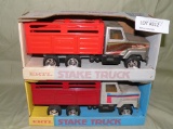 ERTL STEEL INTERNATIONAL STAKE TRUCKS W/BOXES - 2 TIMES MONEY