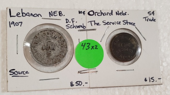 2 NEBRASKA ADVERTISING TRADE TOKENS - 2 TIMES MONEY