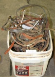 SMALL BUCKET OF ASSORTED HORSE BITS, REINS, PARTS
