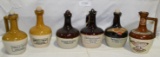 6 ADVERTISING STONEWARE DECANTERS W/STOPPERS