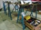 Three metal saw horses and particle board top