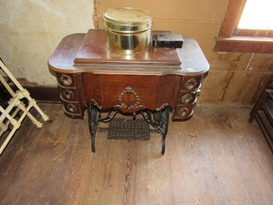 Treadle sewing machine and cabinet