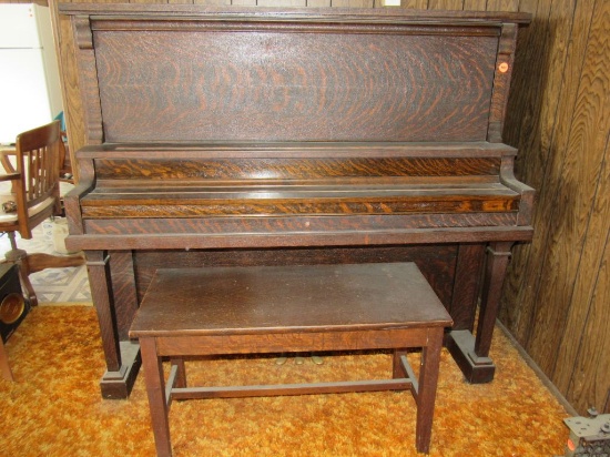 Upright piano with bench