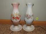 2 hurricane lamps