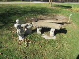 Concrete bench and statue