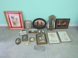 Grouping of different sizes and shapes of framed pictures