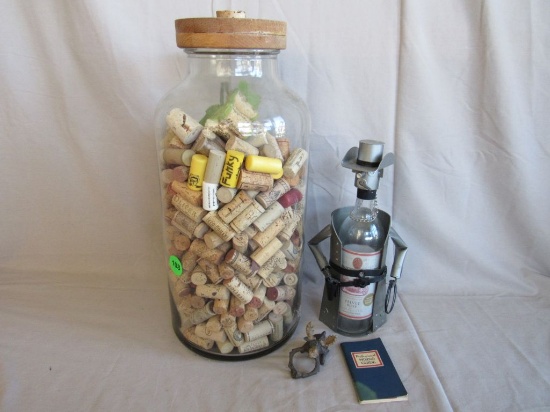 Large glass jar with corks and others