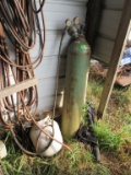Oxygen tank and propane tank with hoses