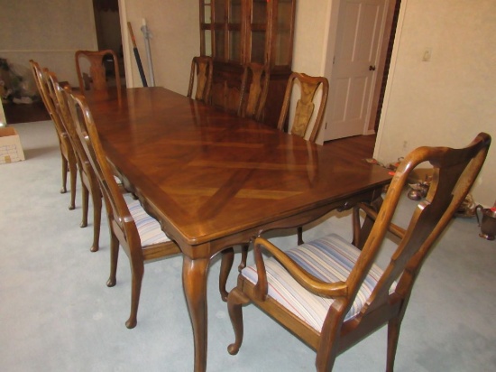 Large dining room table and upholstered chairs