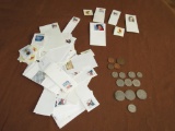 Assorted foreign coins and stamps