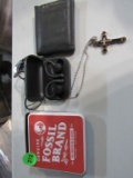 Earbuds, necklace with cross, and bill fold